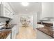 Galley kitchen with granite countertops and white cabinets at 9662 Sw 95Th Ct # A, Ocala, FL 34481