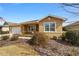 Tan one-story house with a two-car garage and landscaped yard at 9840 Sw 90Th St, Ocala, FL 34481