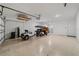 Garage with golf cart, storage, and overhead storage at 9840 Sw 90Th St, Ocala, FL 34481