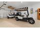 Garage with golf cart and overhead storage at 9840 Sw 90Th St, Ocala, FL 34481