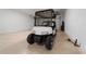 Garage with golf cart and overhead storage at 9840 Sw 90Th St, Ocala, FL 34481