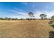 View of a golf course with homes in the background at 9840 Sw 90Th St, Ocala, FL 34481