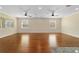 Sunlit living room showcasing hardwood floors and a neutral color palette at 9840 Sw 90Th St, Ocala, FL 34481