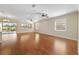 Large living room with hardwood floors and ceiling fans at 9840 Sw 90Th St, Ocala, FL 34481