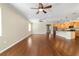 Bright living room with hardwood floors and two ceiling fans at 9840 Sw 90Th St, Ocala, FL 34481