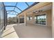 Expansive screened patio with ceiling fans and a view at 9840 Sw 90Th St, Ocala, FL 34481