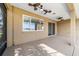 Covered patio with ceiling fans and sliding glass door access at 9840 Sw 90Th St, Ocala, FL 34481