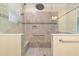 Walk-in shower with tiled walls and seat at 9840 Sw 90Th St, Ocala, FL 34481