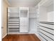 Large walk-in closet with ample shelving and drawers at 9840 Sw 90Th St, Ocala, FL 34481