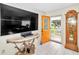 Bright entryway with a large TV, console table, and grandfather clock at 9981 Sw 101St Pl, Ocala, FL 34481