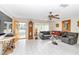 Living room with L-shaped sofa and view of front porch at 9981 Sw 101St Pl, Ocala, FL 34481