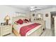 Main bedroom with king-size bed and updated flooring at 9981 Sw 101St Pl, Ocala, FL 34481