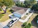 House with a large backyard and a truck parked in the driveway at 10602 Se 179Th Ln, Summerfield, FL 34491