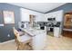 Modern kitchen with white cabinets, granite countertops, and stainless steel appliances at 10602 Se 179Th Ln, Summerfield, FL 34491