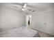 Neutral bedroom with a ceiling fan and a glimpse into the next room at 11 Bahia Court Loop, Ocala, FL 34472