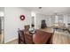 Cozy dining area with wood floors and a decorative wreath adding a touch of warmth at 11 Bahia Court Loop, Ocala, FL 34472