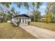 House exterior showcasing landscaping and driveway at 11 Bahia Court Loop, Ocala, FL 34472