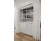 Convenient laundry area with modern appliances and built-in storage shelves at 11 Bahia Court Loop, Ocala, FL 34472