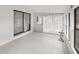 Bright sunroom with tile floors and multiple windows, perfect for relaxation at 11 Bahia Court Loop, Ocala, FL 34472