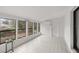 Sunroom featuring tile floors, ample windows, and access to backyard at 11 Bahia Court Loop, Ocala, FL 34472