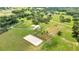 Aerial view of property with home, pool and paddocks at 12000 S Highway 475, Ocala, FL 34480
