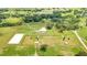 Aerial view showing home, pool, and large acreage at 12000 S Highway 475, Ocala, FL 34480