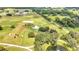 Aerial view of property with home, pool, and paddocks at 12000 S Highway 475, Ocala, FL 34480