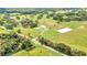 Aerial view of a home with a pool and horse facilities at 12000 S Highway 475, Ocala, FL 34480