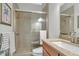 Updated bathroom with walk-in shower and granite vanity at 12000 S Highway 475, Ocala, FL 34480