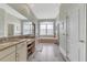Spa-like bathroom featuring double vanity, soaking tub, and ample natural light at 12000 S Highway 475, Ocala, FL 34480