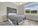 Charming bedroom with rustic headboard and window view at 12000 S Highway 475, Ocala, FL 34480
