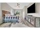 Spacious bedroom with large window, hardwood floors, and a stylish headboard at 12000 S Highway 475, Ocala, FL 34480