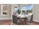 Breakfast nook with a round table and four chairs, overlooking the pool at 12000 S Highway 475, Ocala, FL 34480