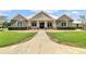 Beautiful two-story home with stone accents and landscaping at 12000 S Highway 475, Ocala, FL 34480