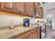 Kitchen boasts granite countertops and ample cabinetry at 12000 S Highway 475, Ocala, FL 34480