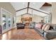 Spacious living room with high ceilings, leather furniture, and a large area rug at 12000 S Highway 475, Ocala, FL 34480