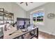Home office with large window, built-in shelving, and a spacious desk at 12000 S Highway 475, Ocala, FL 34480