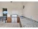 Outdoor kitchen with granite countertops, stainless steel appliances, and a sink at 12000 S Highway 475, Ocala, FL 34480