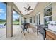 Spacious covered patio with ceiling fans and a grill at 12000 S Highway 475, Ocala, FL 34480