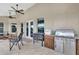 Relaxing outdoor patio with seating, ceiling fans and grill at 12000 S Highway 475, Ocala, FL 34480