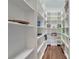 Walk-in pantry with ample shelving for storage at 12000 S Highway 475, Ocala, FL 34480