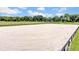 Well-maintained riding arena with black fencing at 12000 S Highway 475, Ocala, FL 34480
