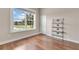 Bright spare bedroom with large window and wood flooring at 12000 S Highway 475, Ocala, FL 34480