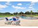 Relaxing pool area with lounge chairs and a stone waterfall at 12000 S Highway 475, Ocala, FL 34480