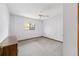 Bedroom with dresser, carpet, and ceiling fan at 15135 Ne 142Nd Pl, Fort Mc Coy, FL 32134