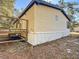 Side view of mobile home with deck and yard at 17445 Se 11Th St, Silver Springs, FL 34488