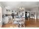 Casual dining area with hardwood floors and view of kitchen at 1941 Yellow Pine Pl, The Villages, FL 32162