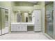Primary bathroom with double vanity and walk-in shower at 2021 Se Twin Bridge Cir, Ocala, FL 34471