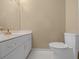 Modern bathroom with white vanity and gold fixtures at 2021 Se Twin Bridge Cir, Ocala, FL 34471