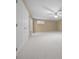 Large bedroom with neutral carpeting and ceiling fan at 2021 Se Twin Bridge Cir, Ocala, FL 34471